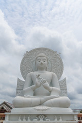 White Buddha statue - The attitude of giving the first sermon in "Sangdhamsongchevit" Spiritual Center at Saraburi, Thailand.