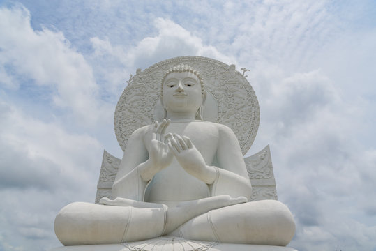 White Buddha statue - The attitude of giving the first sermon in "Sangdhamsongchevit" Spiritual Center at Saraburi, Thailand.
