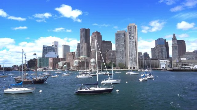 BOSTON, MA - Circa June, 2016 - A daytime establishing shot of the Boston skyline as seen from the harbor.	 	