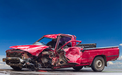 .Red crumpled car wrecked.