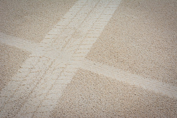 Tire from tracks on the sand background