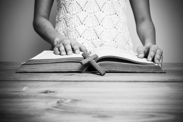 A close-up of a christian woman reading the bible.
