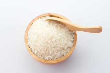 Fototapeta na wymiar wooden bowl of jasmine rice grain on white background