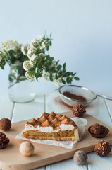 Apple pie with whipped cream covered by grated chocolate