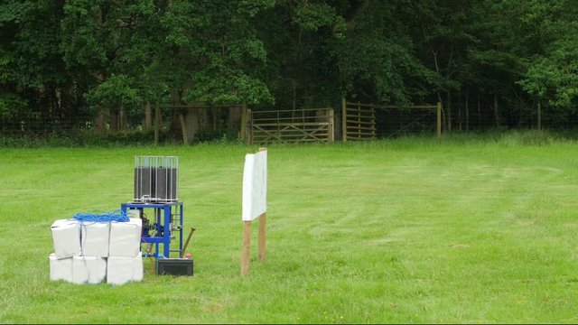 View of automatic trap thrower for clay pigeon shooting low trajectory in action