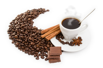 cup of coffee with cinnamon sticks, anise and chocolate