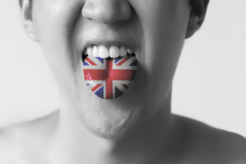Great Britain flag painted in tongue of a man - indicating English language and British accent...