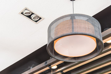 orange round stylish lampshades hang from ceiling