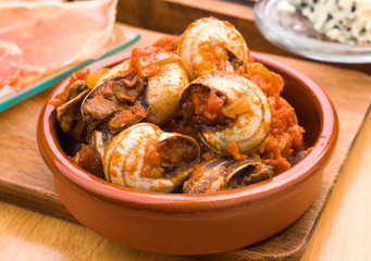 appetizer of snails cooked in sauce