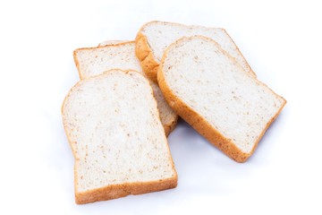 pile of whole grain bread slice isolated on white background. 
slices of soft whole wheat bread breakfast on every morning.