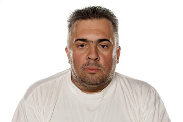 Fototapeta premium Portrait of a serious obese man