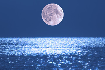 Moonrise over ocean/sea horizon. My work. No elements of NASA or other third party. Moon is my work.
