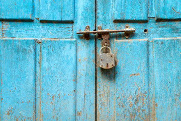 Padlock on a blue door