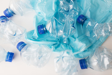 close up of used plastic bottles and rubbish bag