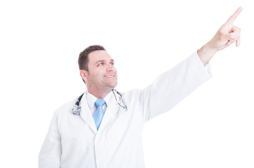 Male doctor or medic looking and pointing up feeling positive