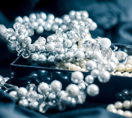 Pearl necklace with blurred background on black