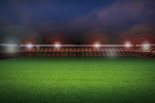 empty soccer field with stadium at night