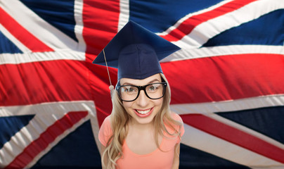 student woman in mortarboard over english flag