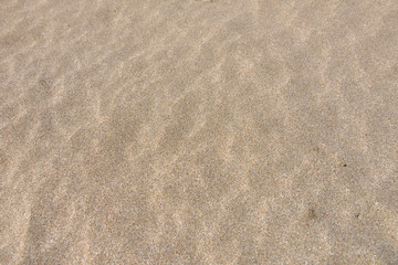 Close up of sand on a beach, sandy beach background