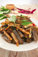 Razor clams spicy Stir-Fry on wood