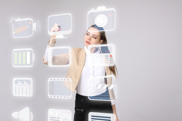Woman pressing multimedia and entertainment icons on a virtual background