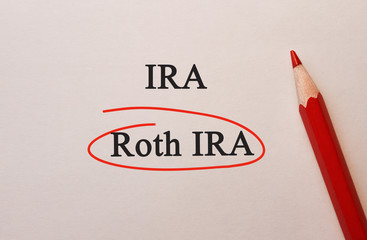 Roth IRA in red circle with pencil on textured paper