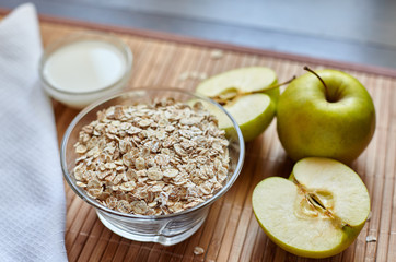 Breakfast. Oatmeal with milk, juice, banana, apple and lemon