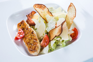 Fresh salad with chicken breast. Restaurant food concept