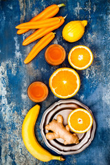 Fototapeta na wymiar Carrot ginger immune boosting, anti inflammatory smoothie with turmeric and honey. Detox morning juice drink, clean eating