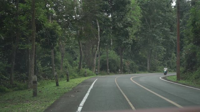 Thai rural jungle road. First person view