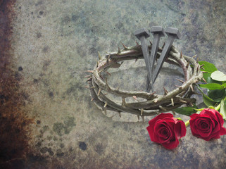 Jesus Christ crown of thorns, nails and two roses.