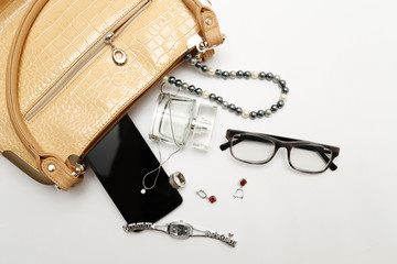 female bag with a variety of personal belongings