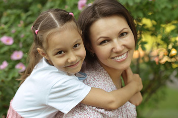 girl with mother in park