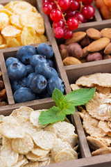 breakfast cereal and other fresh ingredients in a wooden box