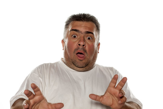 obese frightened man on a white background