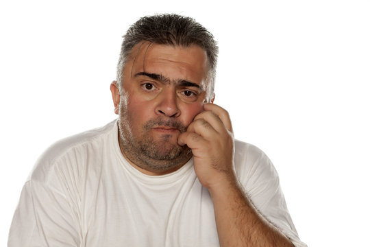 fat worried man thinking on a white background