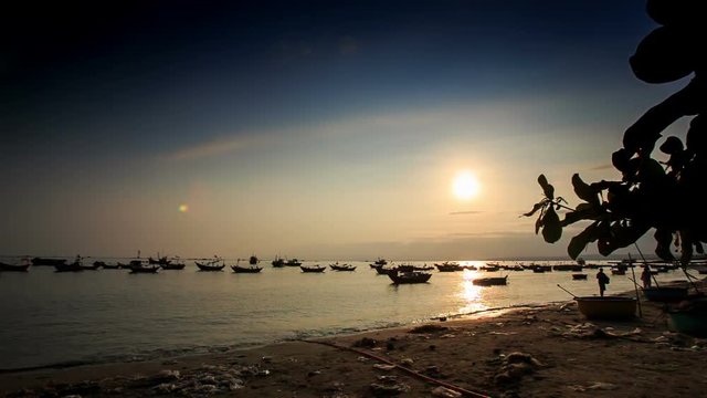 Fishing Boats in Sea Bay at Sunset from Beach in Vietnam