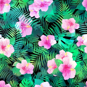 Seamless pattern with exotic hibiscus flowers and palm leaves.