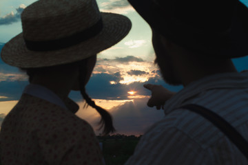 Young couple in love in the meadow