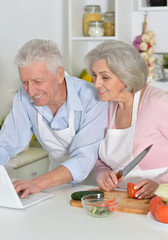 senior man and woman  in the kitchen