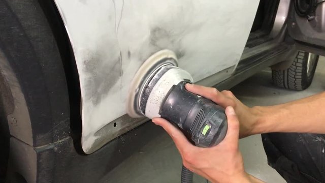Grinding detail of car, car repair