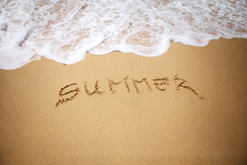 summer written in sand