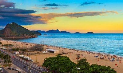 Sunset view of Copacabana beach and Avenida Atlantica in Rio de Janeiro, Brazil