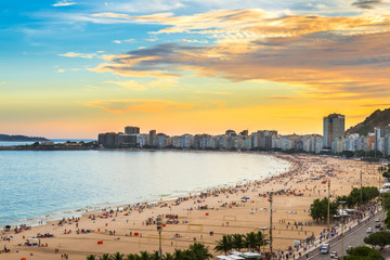 Fototapeta na wymiar Sunset view of Copacabana beach and Avenida Atlantica in Rio de Janeiro, Brazil