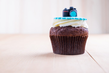 Delicious cupcake on table