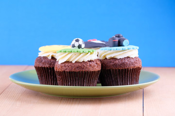 Delicious cupcakes on table