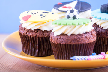 Delicious cupcakes on table