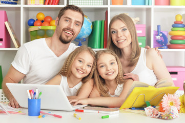 happy family with laptop 
