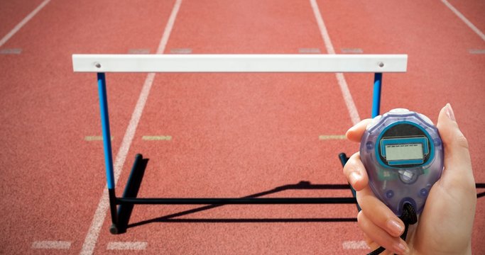 Close up of woman is holding a stopwatch - Powered by Adobe