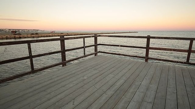 Sunset at the Pier gola beach in Santa Pola, Spain.